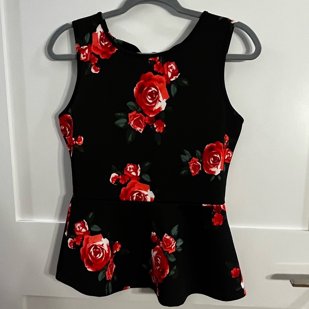 Peplum thick spandex material top with cutout in back size S/M womens